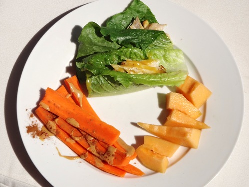 Low FODMAP travel meal- plain chicken on lettuce wrap carrots with nut butter melon